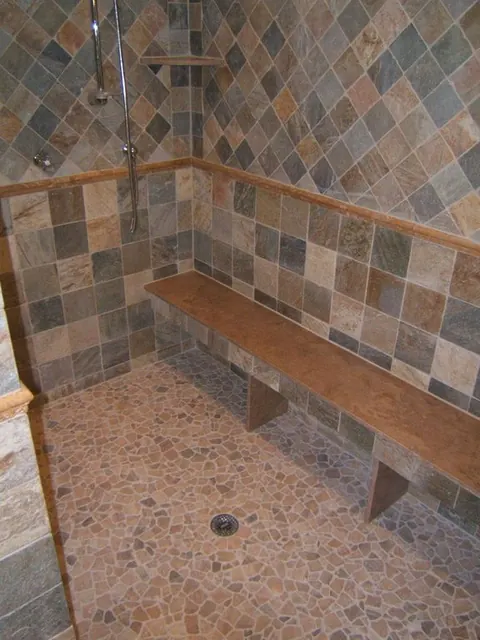 Pebble shower floor with slate walls