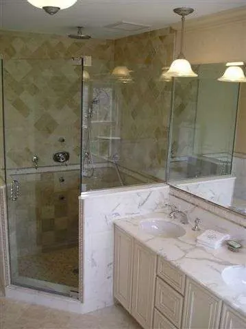 Tiled shower with glass enclosure